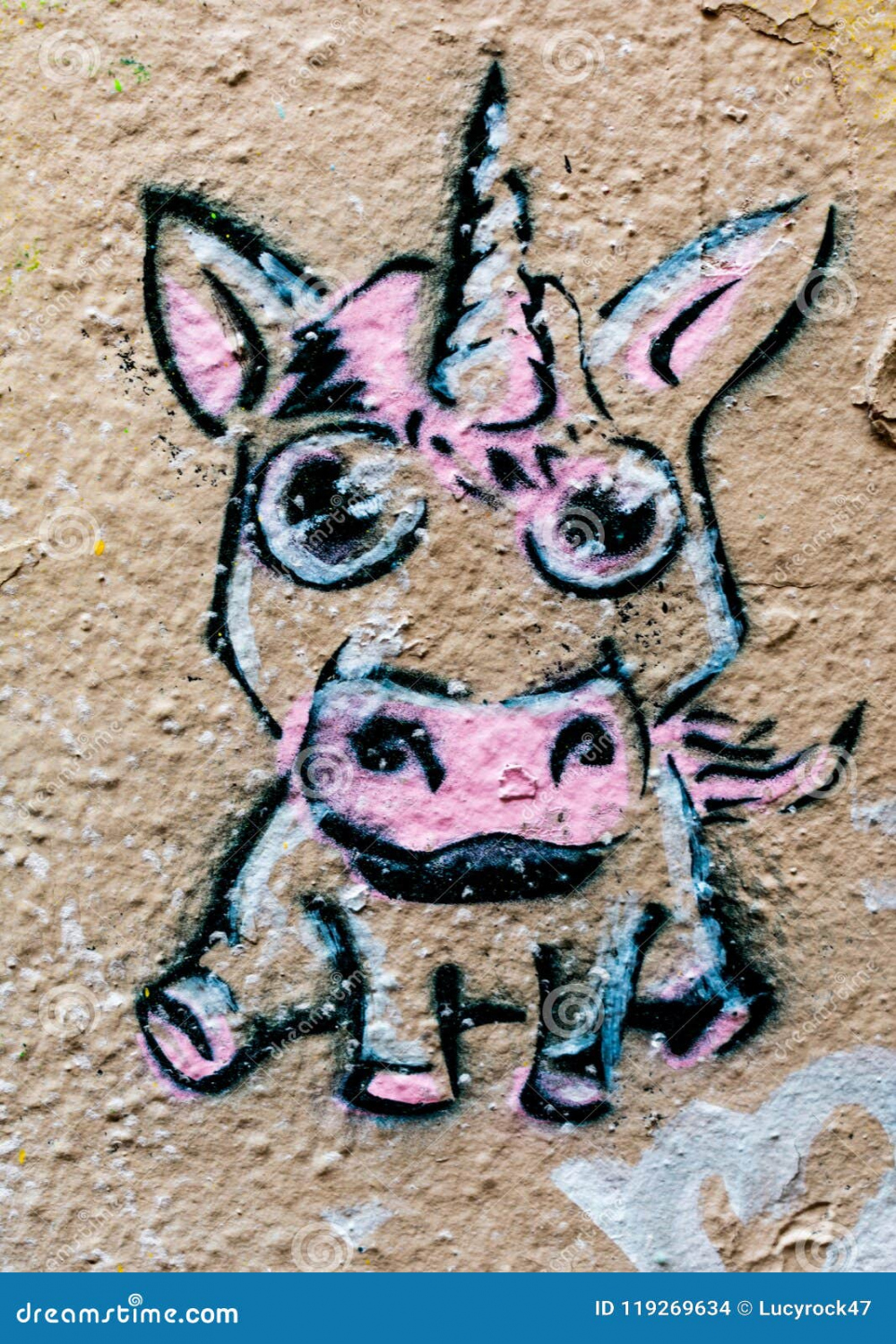 A pink graffiti unicorn stock photo