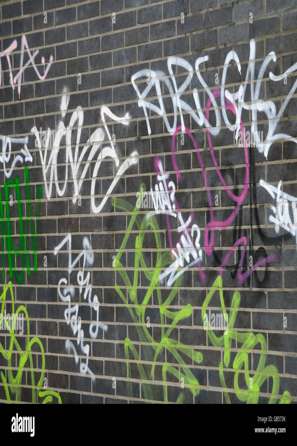 Graffiti tags on brick wall hi-res stock photography and images