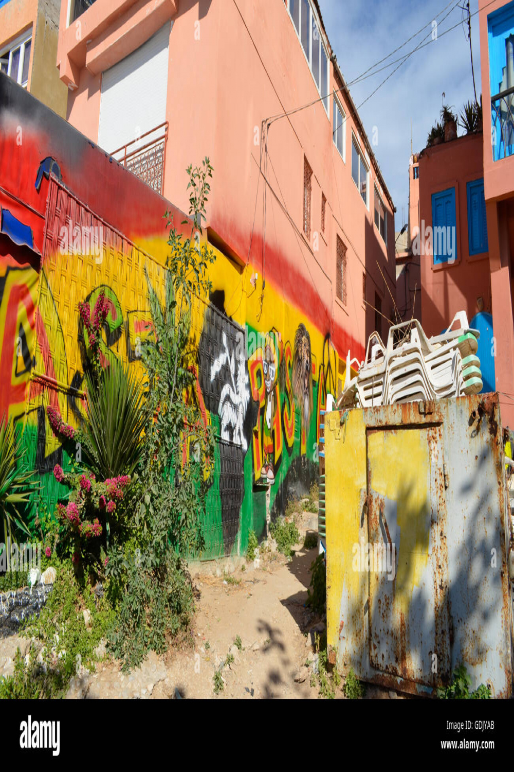 Reggae Street art drawn on a wall on the beach in Taghazout