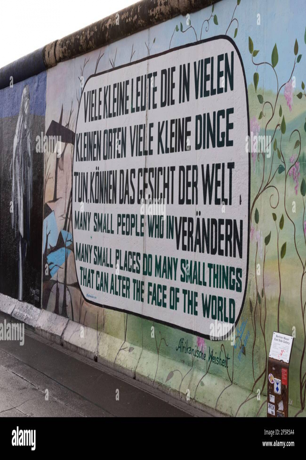 A close up of a famous quote and graffiti on the Berlin Wall Stock