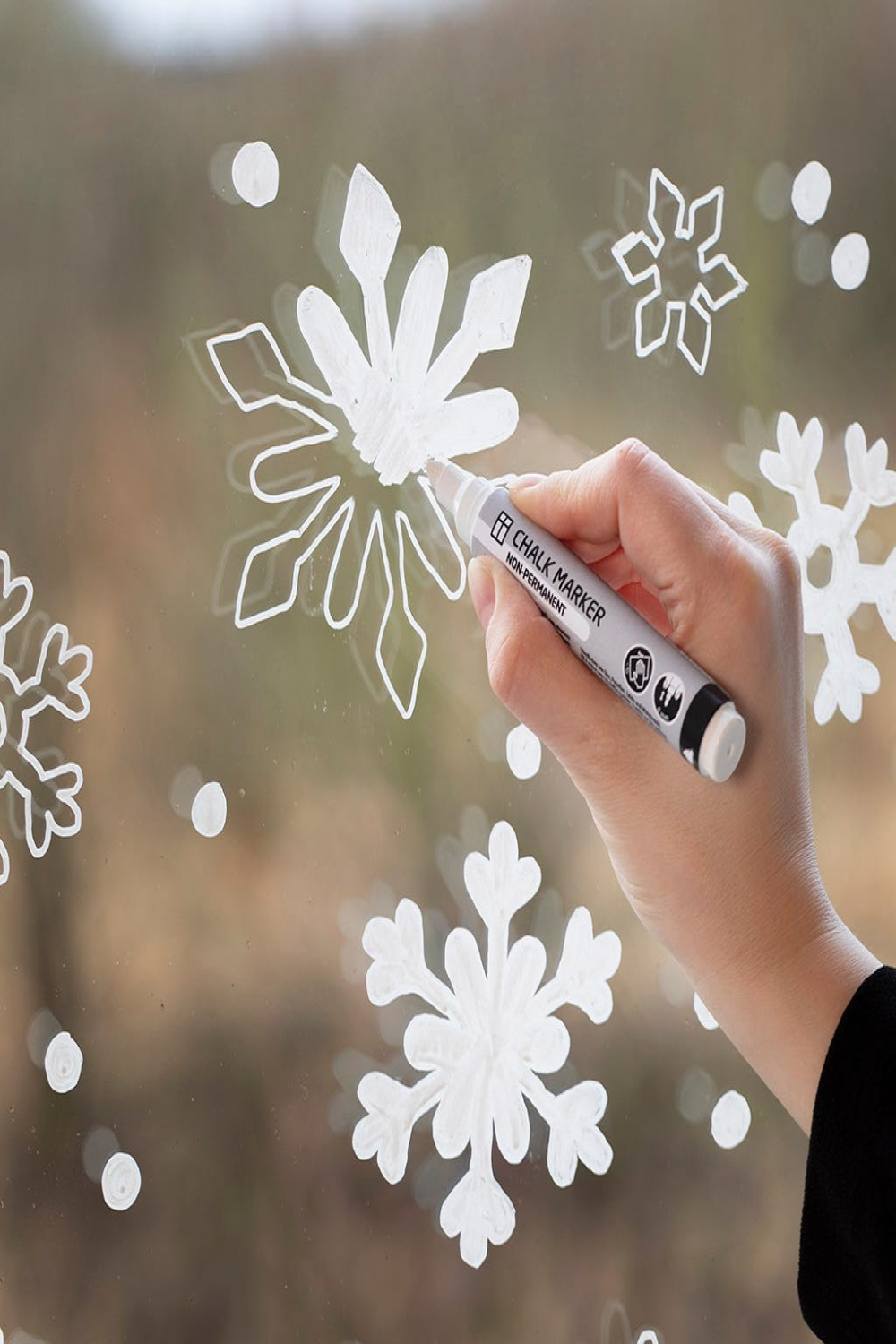 Snowflake window decoration with chalk markers